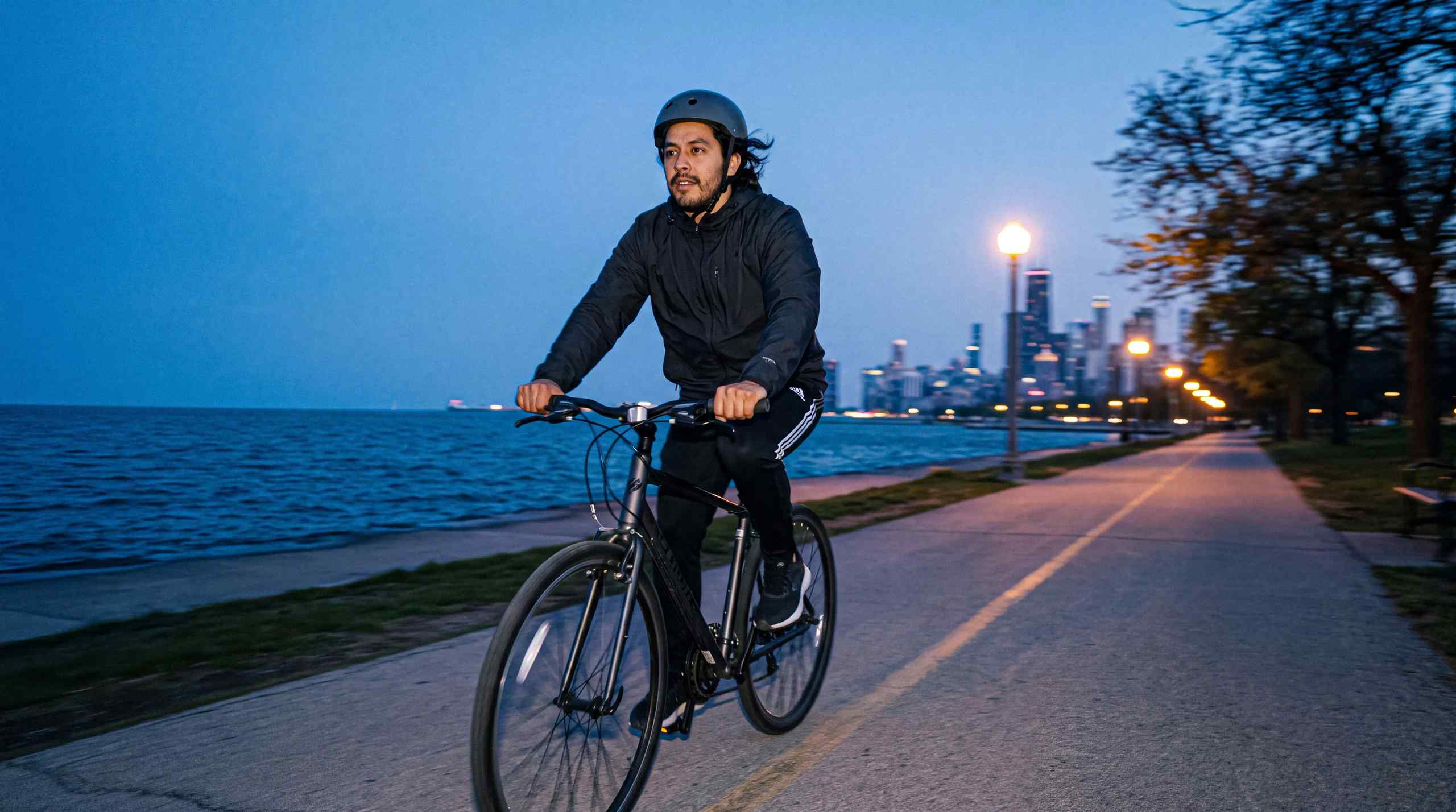 A man cycling in the city.